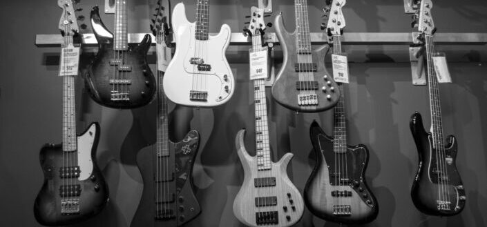 A display of bass guitars in the store